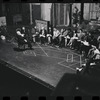 George Abbott [front] and unidentified others in rehearsal for the stage production Flora, the Red Menace