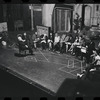 George Abbott [front] and unidentified others in rehearsal for the stage production Flora, the Red Menace