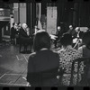 George Abbott [center] and unidentified others in rehearsal for the stage production Flora, the Red Menace