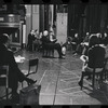 George Abbott [center] and unidentified others in rehearsal for the stage production Flora, the Red Menace
