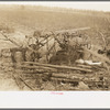 Because of lack of storage space it is necessary to keep agricultural implements in the open. Sharecropper farm near Pace, Mississippi. Background photo for Sunflower Plantation