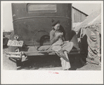 Migrant girl sitting in back of car, Weslaco, Texas