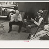 Tourists traveling in trailers talking in camp, McAllen, Texas