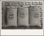 Chicken feed, flour and other bulky products are now bagged in printed cotton materials for use as dress materials. Mercedes, Texas