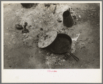 Skillet with skeleton lid and coffee pot in active use by white migrant family from Arizona, near Harlingen, Texas