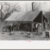 Setting up tent home. Migrant workers near Harlingen, Texas