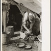 White migrant worker cleaning fish near Mercedes, Texas