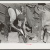 White migrant worker cleaning fish near Mercedes, Texas