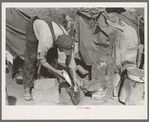 White migrant worker cleaning fish near Mercedes, Texas