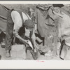 White migrant worker cleaning fish near Mercedes, Texas