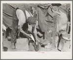 White migrant worker cleaning fish near Mercedes, Texas