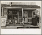 Mexican sitting on porch of store, Alamo, Texas