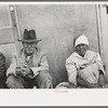 Mexican man and woman waiting for relief commodities, San Antonio, Texas