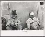 Mexican man and woman waiting for relief commodities, San Antonio, Texas