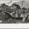 Old automobile with various potted flowers, Mexican district, San Antonio, Texas