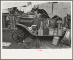 Old automobile with various potted flowers, Mexican district, San Antonio, Texas