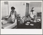 Making tortillas in bake shop, San Antonio, Texas. Tortillas are made of corn flour which is very finely ground and mashed corn. No moisture or baking powder or salt is added