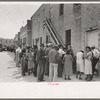 Crowd of people waiting at WPA clothing department, San Antonio, Texas