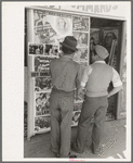 Mexican boys looking at movie poster, San Antonio, Texas