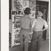 Mexican boys looking at movie poster, San Antonio, Texas