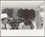 Mexicans looking at suits for sale, San Antonio, Texas