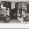 Clothing store with tailor in doorway, Mexican district, San Antonio, Texas