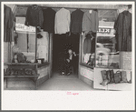 Clothing store with tailor in doorway, Mexican district, San Antonio, Texas