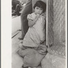 Young Mexican girl who was playing around relief line in San Antonio, Texas