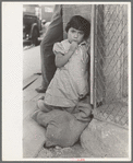 Young Mexican girl who was playing around relief line in San Antonio, Texas