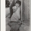 Young Mexican girl who was playing around relief line in San Antonio, Texas