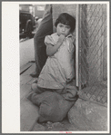 Young Mexican girl who was playing around relief line in San Antonio, Texas