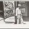 Mexican man in front of movie theater, San Antonio, Texas