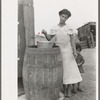 San Antonio. The Mexican section. Water supply of Mexican family living on the outskirts of town. This water is brought from the city and is delivered by wagon