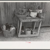 Uncollected garbage and pot plants in back yard of Mexican house, San Antonio, Texas