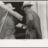Negro Preacher reading the scriptures to Negro man, San Antonio, Texas