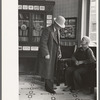 Two men talking in the Great Northern Hotel, Williston, North Dakota