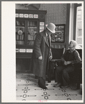 Two men talking in the Great Northern Hotel, Williston, North Dakota