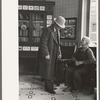 Two men talking in the Great Northern Hotel, Williston, North Dakota