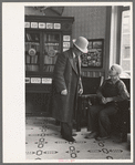 Two men talking in the Great Northern Hotel, Williston, North Dakota