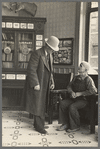 Two men talking in the Great Northern Hotel, Williston, North Dakota