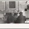 Two men eating breakfast in cafe, Granville, North Dakota
