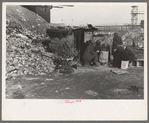Unemployed workers in front of a shack with Christmas tree, East 12th Street, New York City