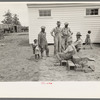 Members of the La Forge Farms Cooperative Society in front of cooperative store
