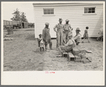 Members of the La Forge Farms Cooperative Society in front of cooperative store