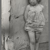 Child of white migrant worker standing by tent home near Harlingen, Texas