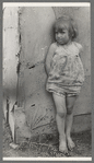 Child of white migrant worker standing by tent home near Harlingen, Texas