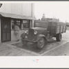 Crates of sweet potatoes being weighed at starch plant, Laurel, Mississippi