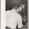 Chemist running test on sweet potato starch, Laurel, Mississippi