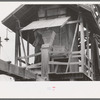 Putting lime into water supply at sweet potato starch plant, Laurel, Mississippi