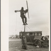 Shrimp fisherman, squatter on Nueces Bay, erecting wind charger for running his radio. Corpus Christi, Texas